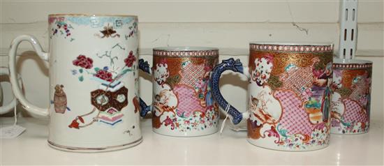 A graduated set of three Chinese export famille rose mugs and another larger, Qianlong period, 10cm-13cm and 16.5cm (4)